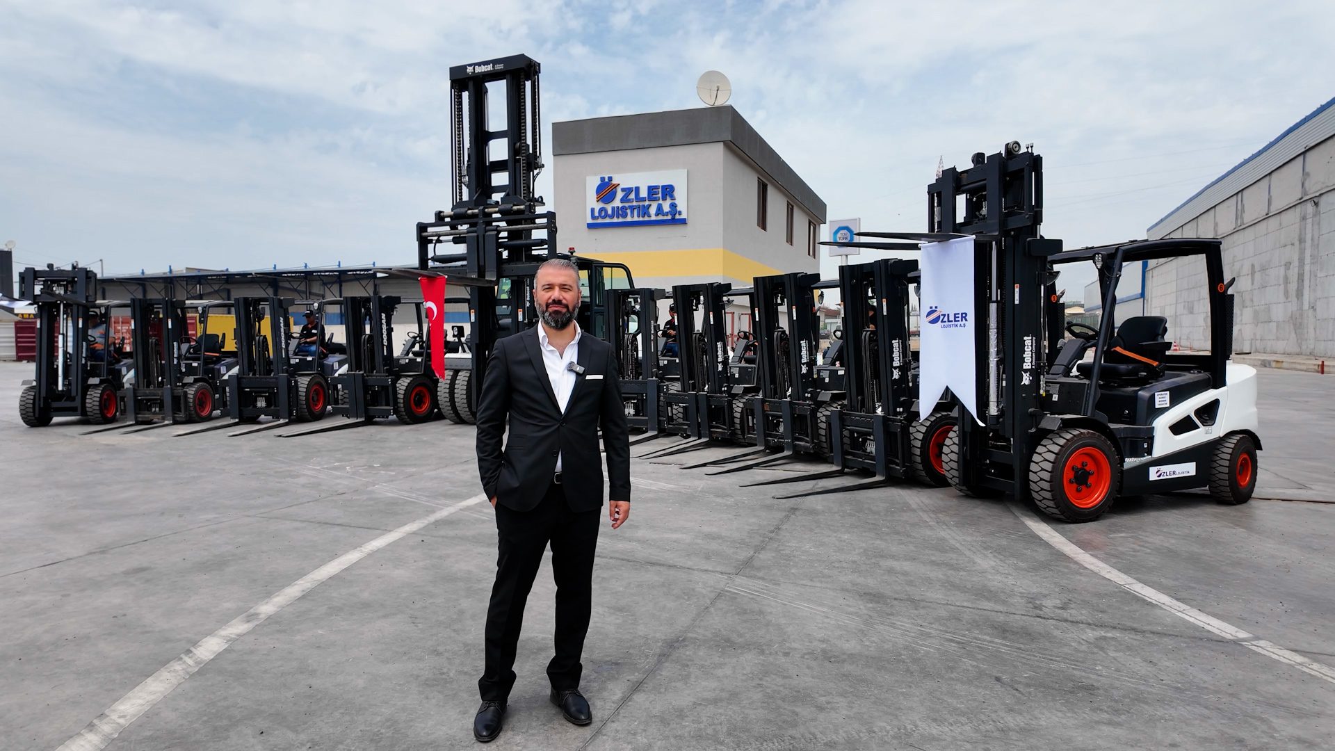 Man with forklifts at OZLER LOJISTIK A.S. facility.