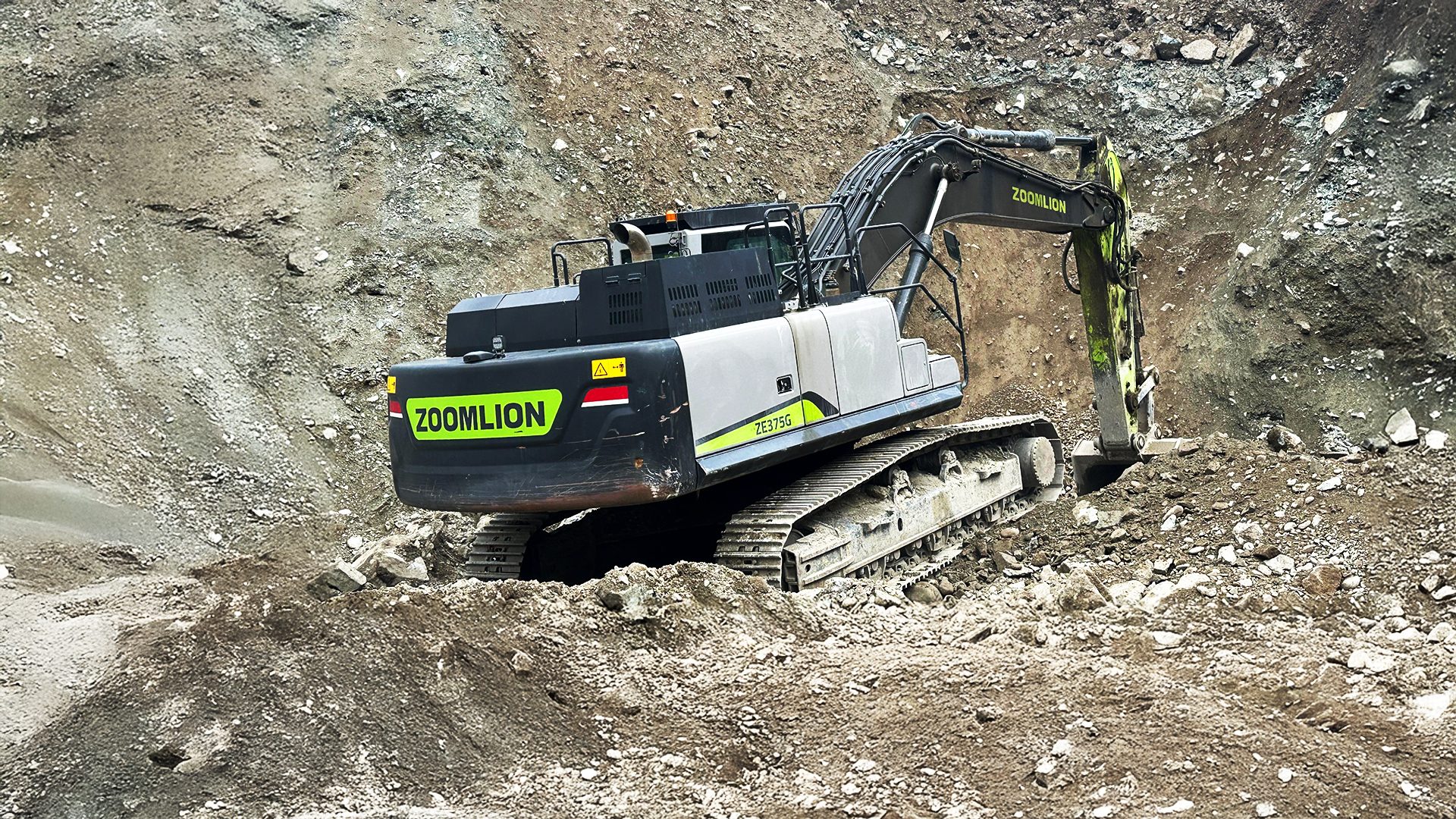 Zoomlion ZE375G excavator working in a dirt excavation site.