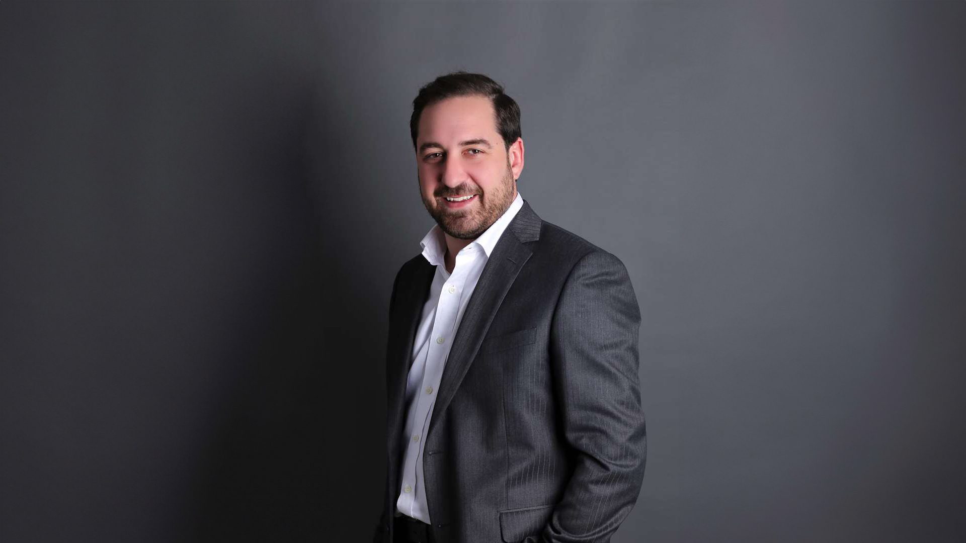 Dress shirt, Flash photography, Smile, Sleeve, Gesture, Collar, Grey