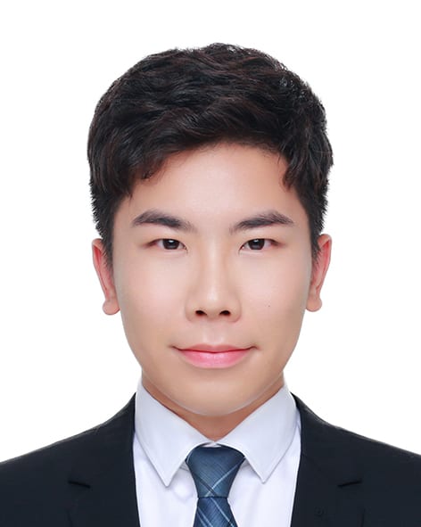 Portrait of a young East Asian man in a suit and tie.