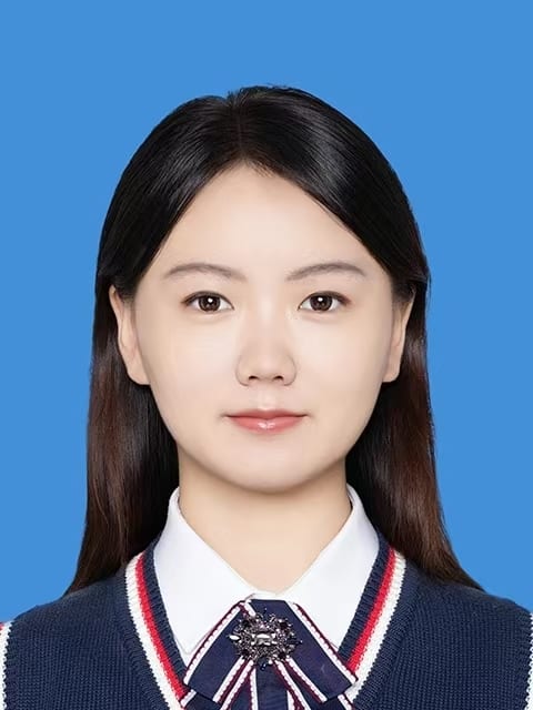 ID photo of a young woman with dark hair in a white shirt and blue striped vest, blue background.