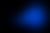 Abstract blue glow, elongated with a curved tail, on a dark background.