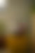 Laptop on yellow cube, screen shows "Let's Outdo Cancer" with eye, Pfizer logo visible.
