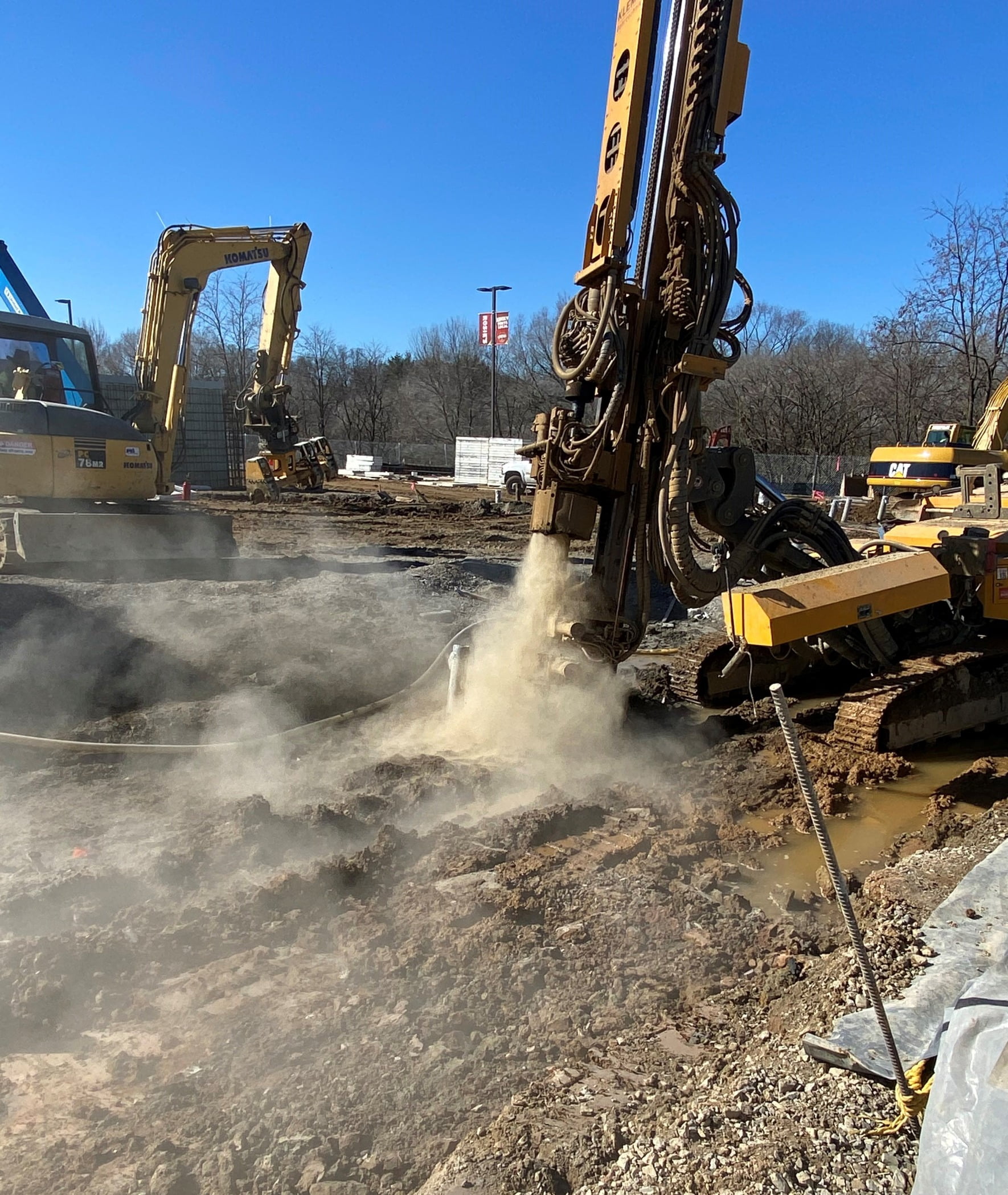 Mode of transport, Road surface, Automotive tire, Composite material, Sky, Vehicle, Asphalt, Bulldozer