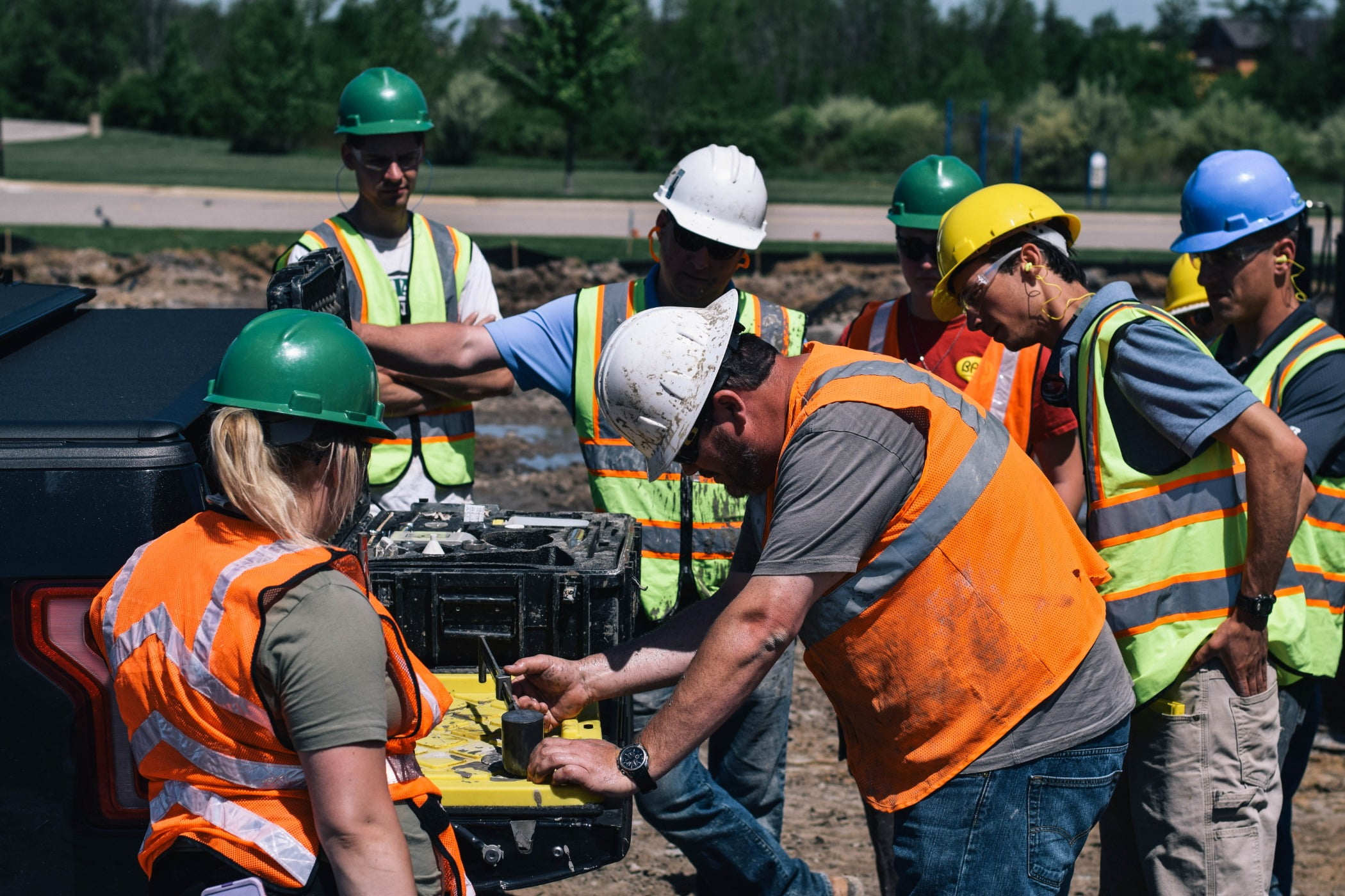 Personal protective equipment, High-visibility clothing, Hard hat, Social group, Job, Team, Community, Green, Workwear, Helmet