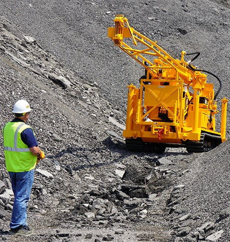 Hard hat, Road surface, Motor vehicle, Yellow, Workwear, Asphalt, Slope