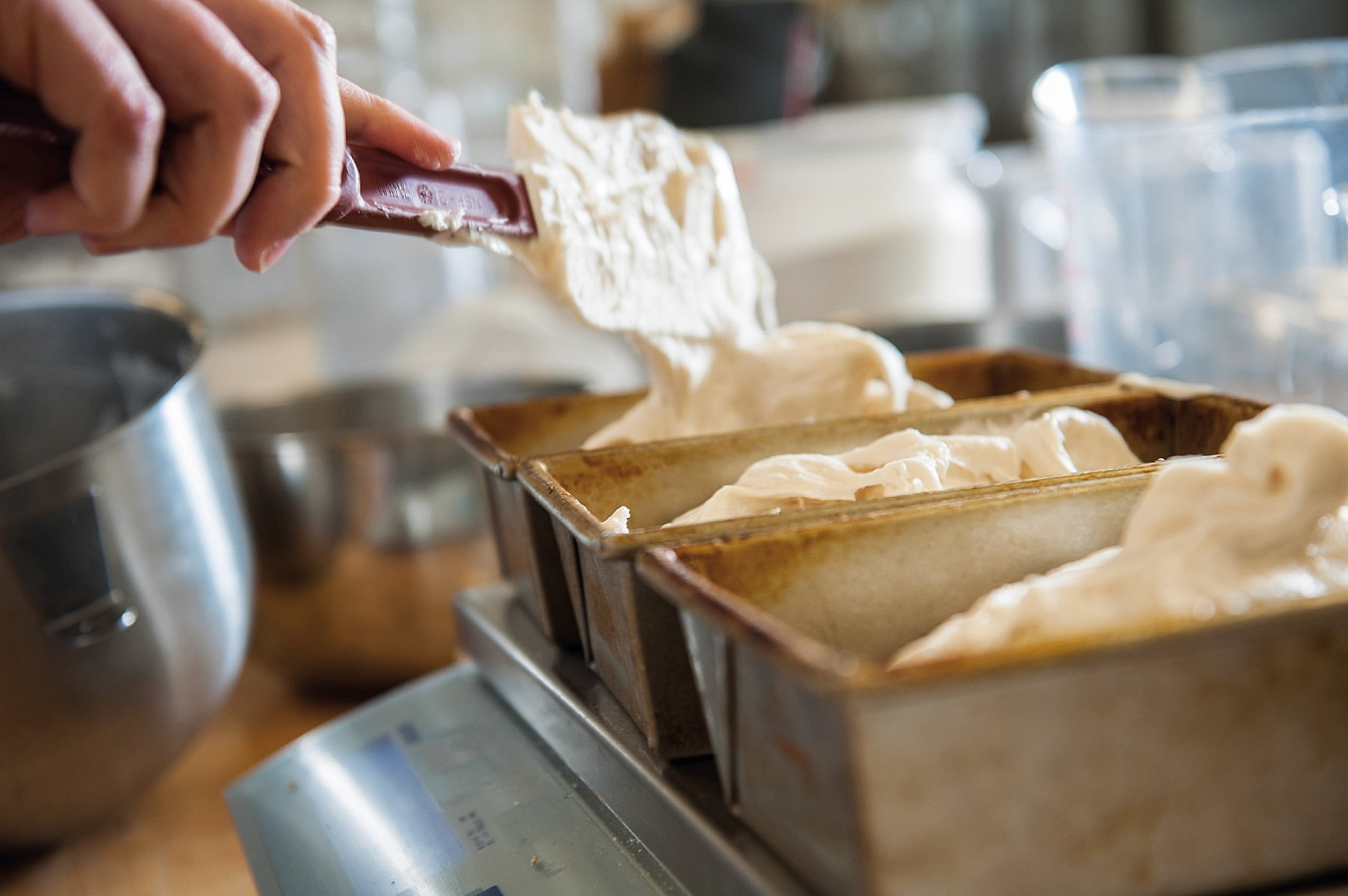 Raw dough, Spatula, Hand, Bread tins, Mixing bowl, Baking