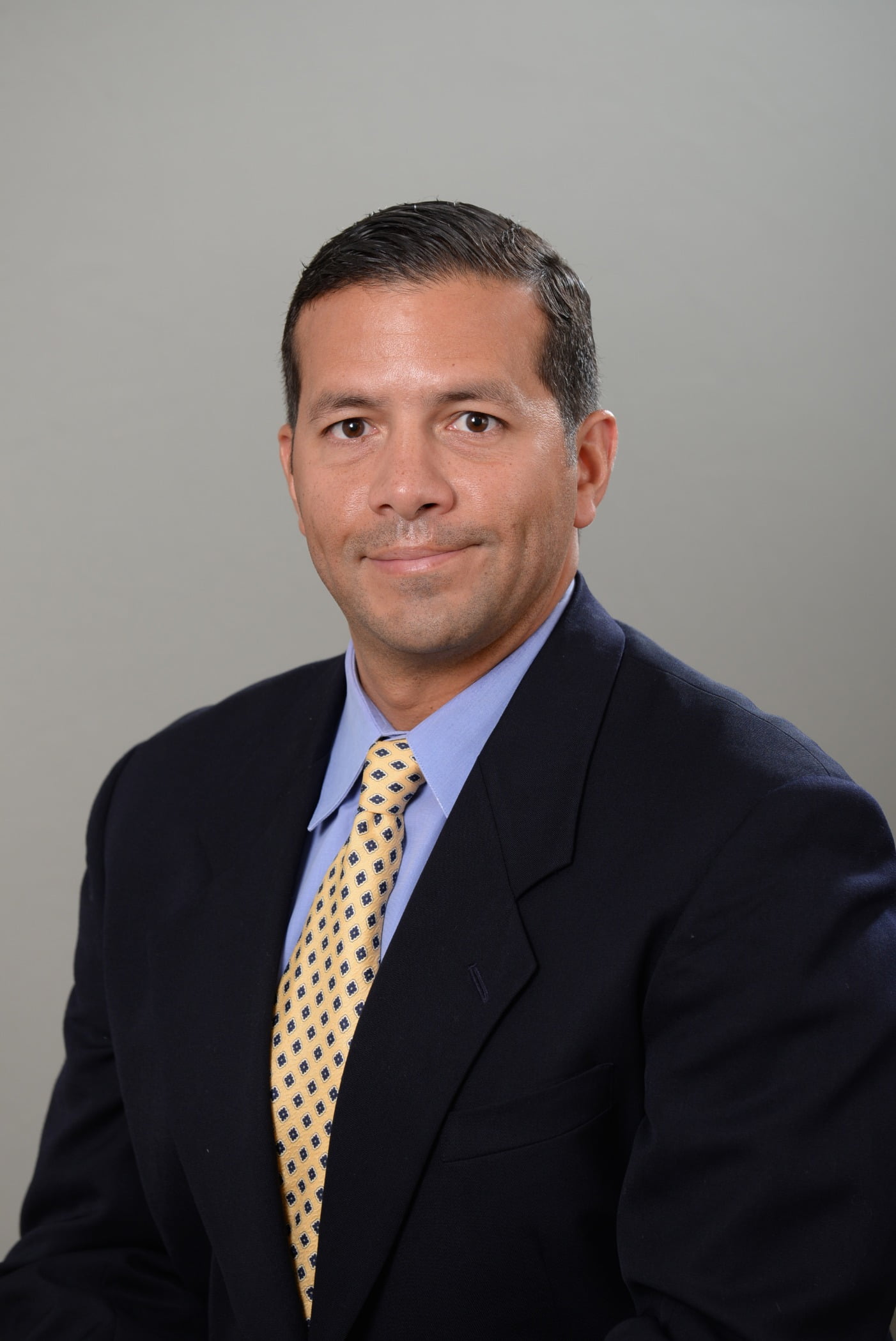 Headshot, Dress shirt, Smile, Coat, Tie, Sleeve, Suit, Gesture, Collar