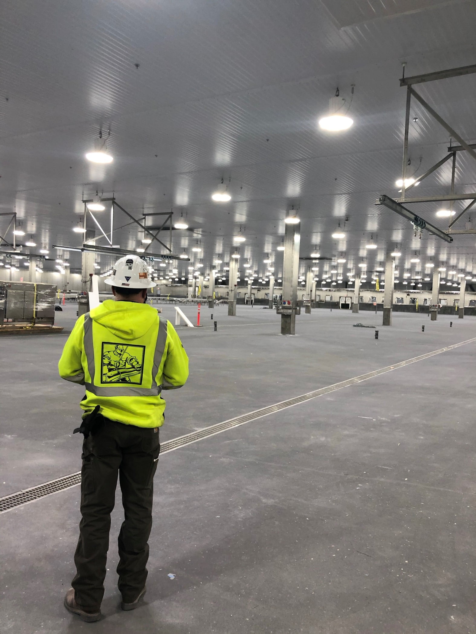 High-visibility clothing, Road surface, Building, Asphalt, Grey, Workwear