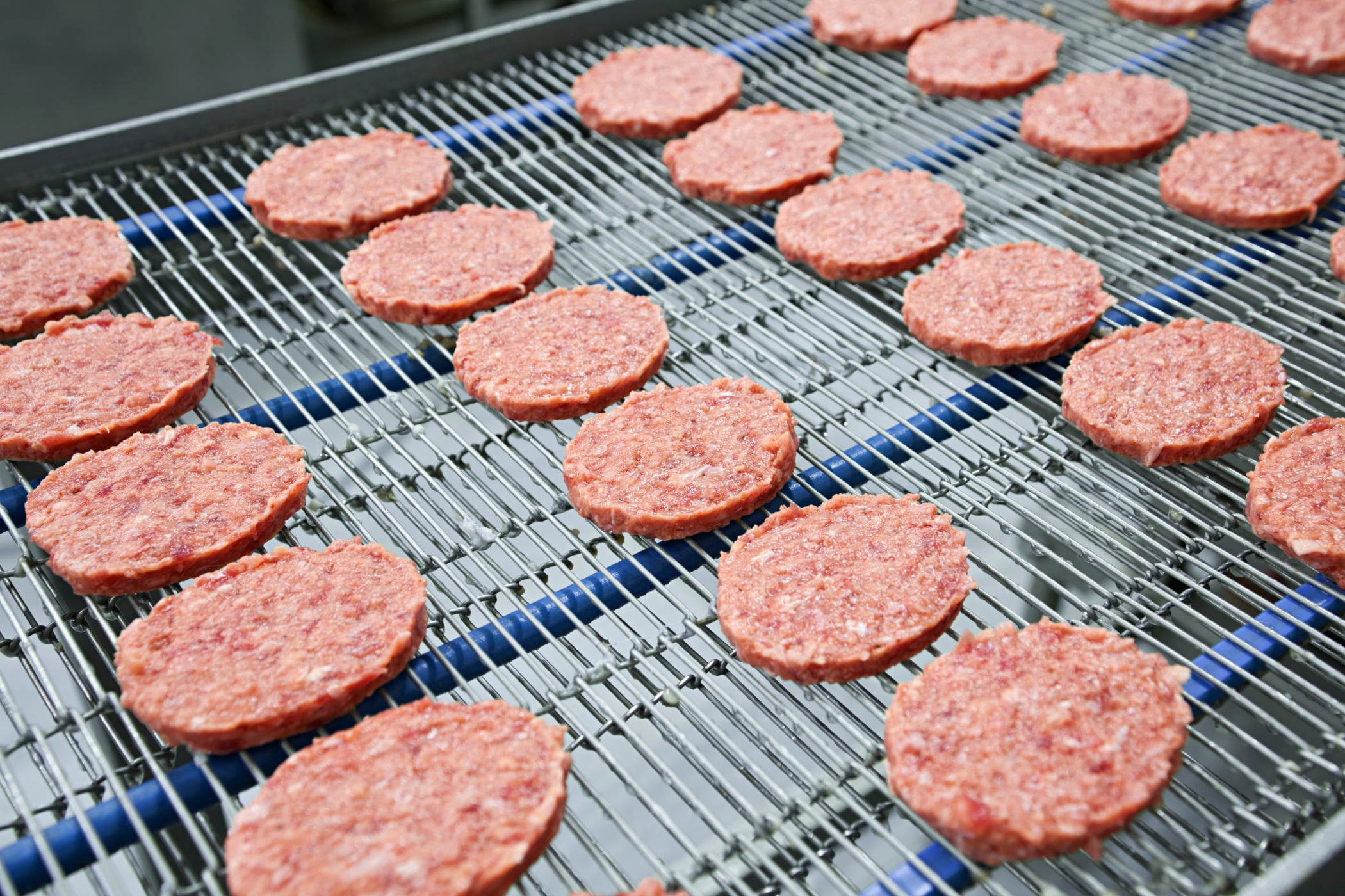 Burgers on a conveyer