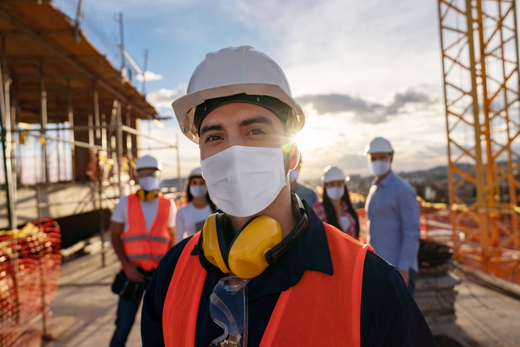 Hard hat, Sky, Outerwear, Helmet, Workwear, Cloud, Engineer, Headgear, Asphalt, Building