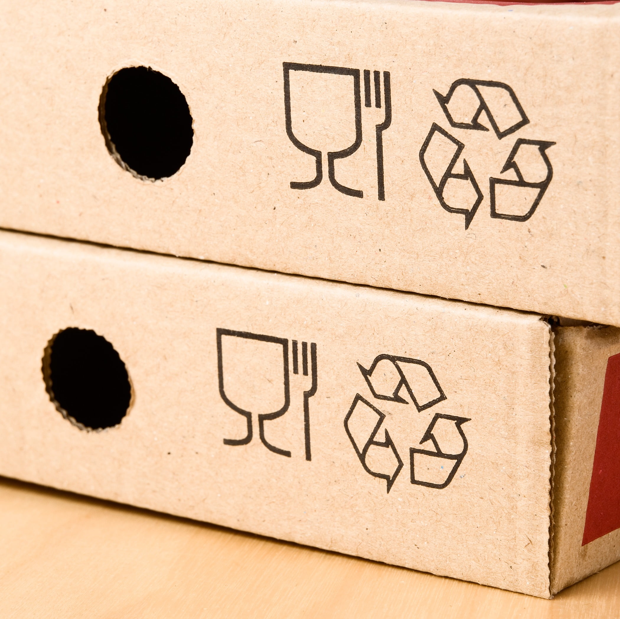 Pizza boxes with recycling logo