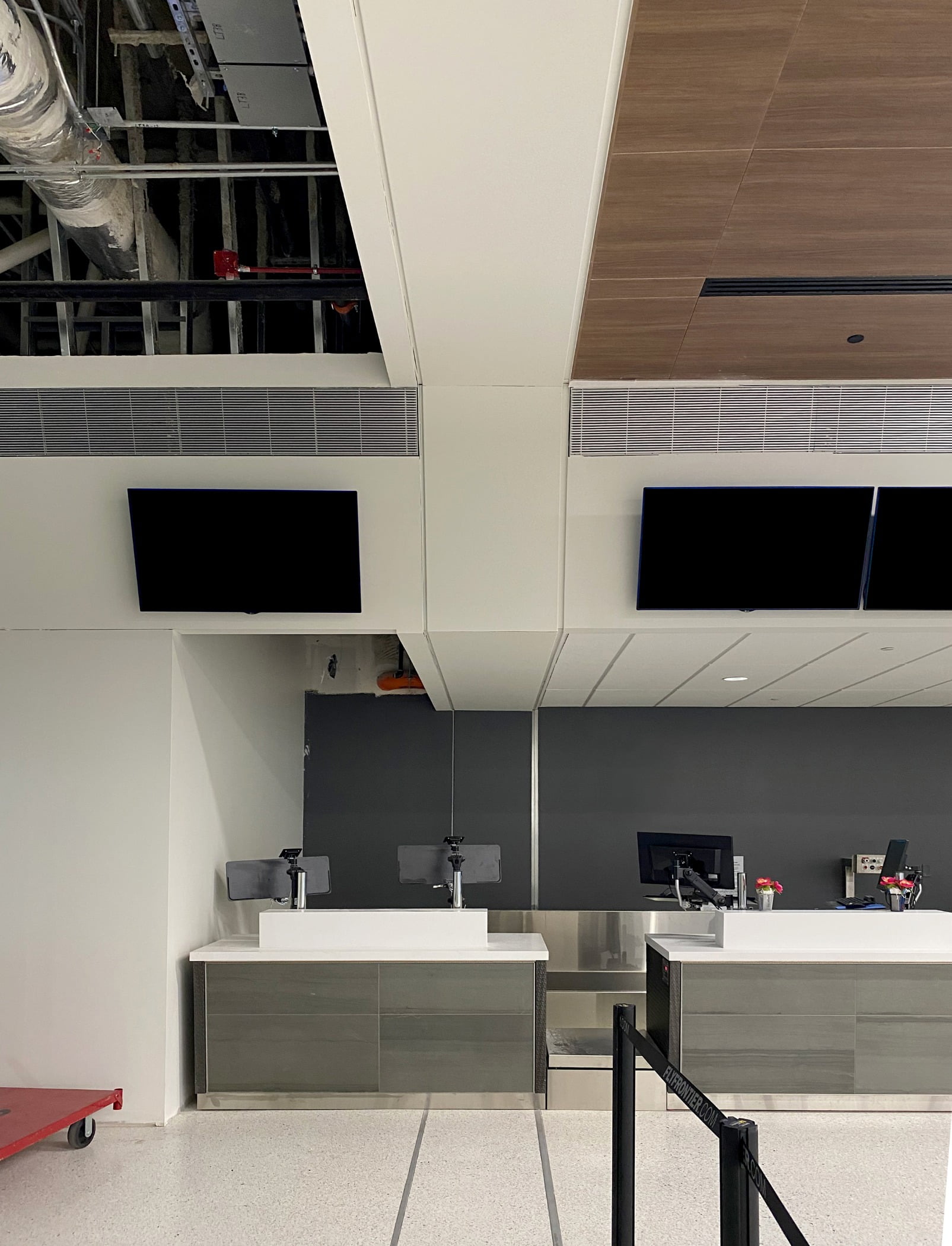 Finished construction near the Frontier Service Desk located in the North Terminal highlights how Balco expansion joint covers provide a matching aesthetic using the PJC floor and FCC wall to soffit and ceiling.