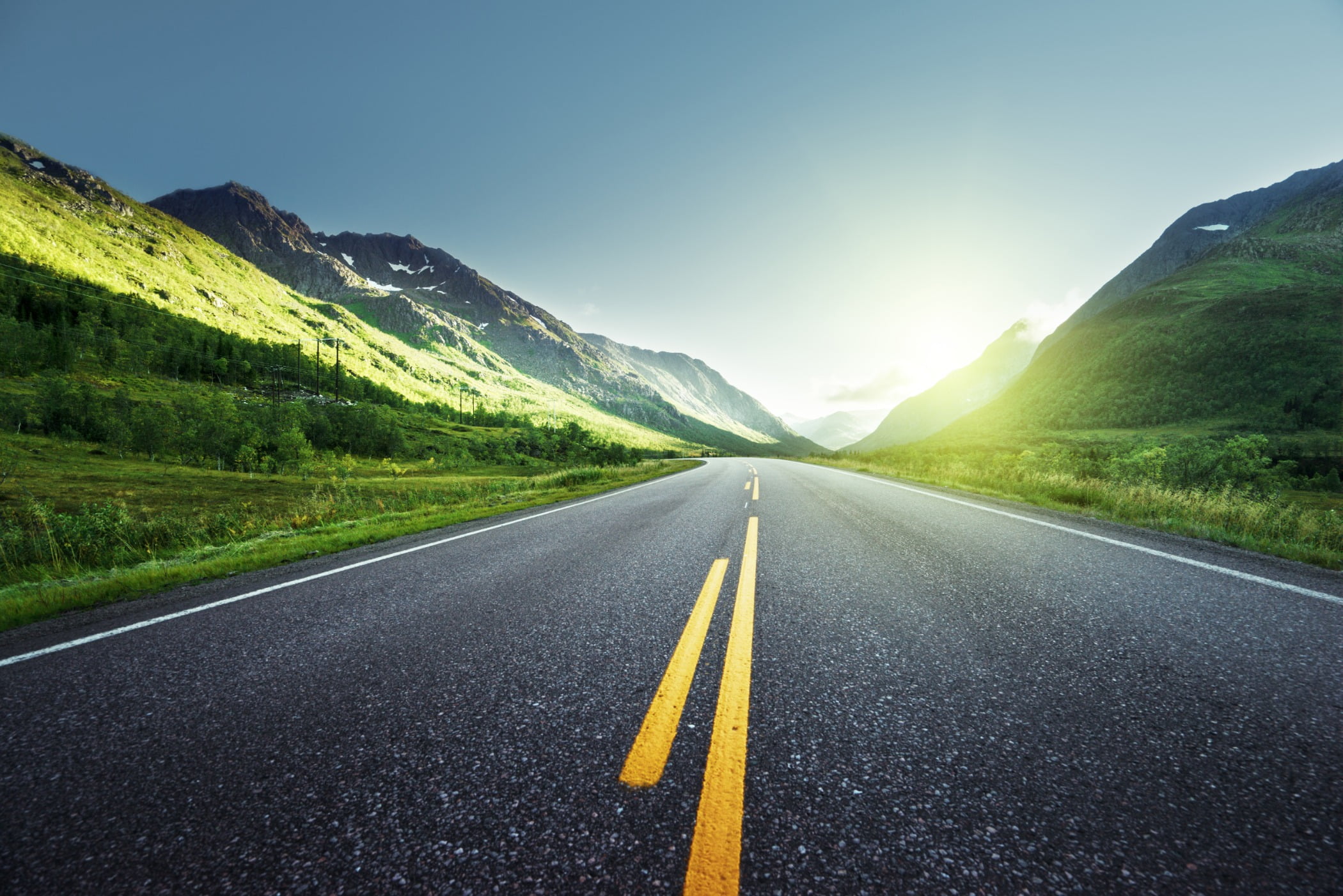 Road surface, Natural landscape, Mountainous landforms, Infrastructure, Asphalt, Yellow, Grass, Green, Nature