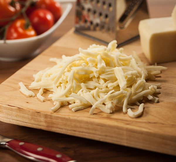 Kitchen utensil, Cutting board, Produce, Dishware, Tomato, Cheese, Tableware, Ingredient, Wood, Food