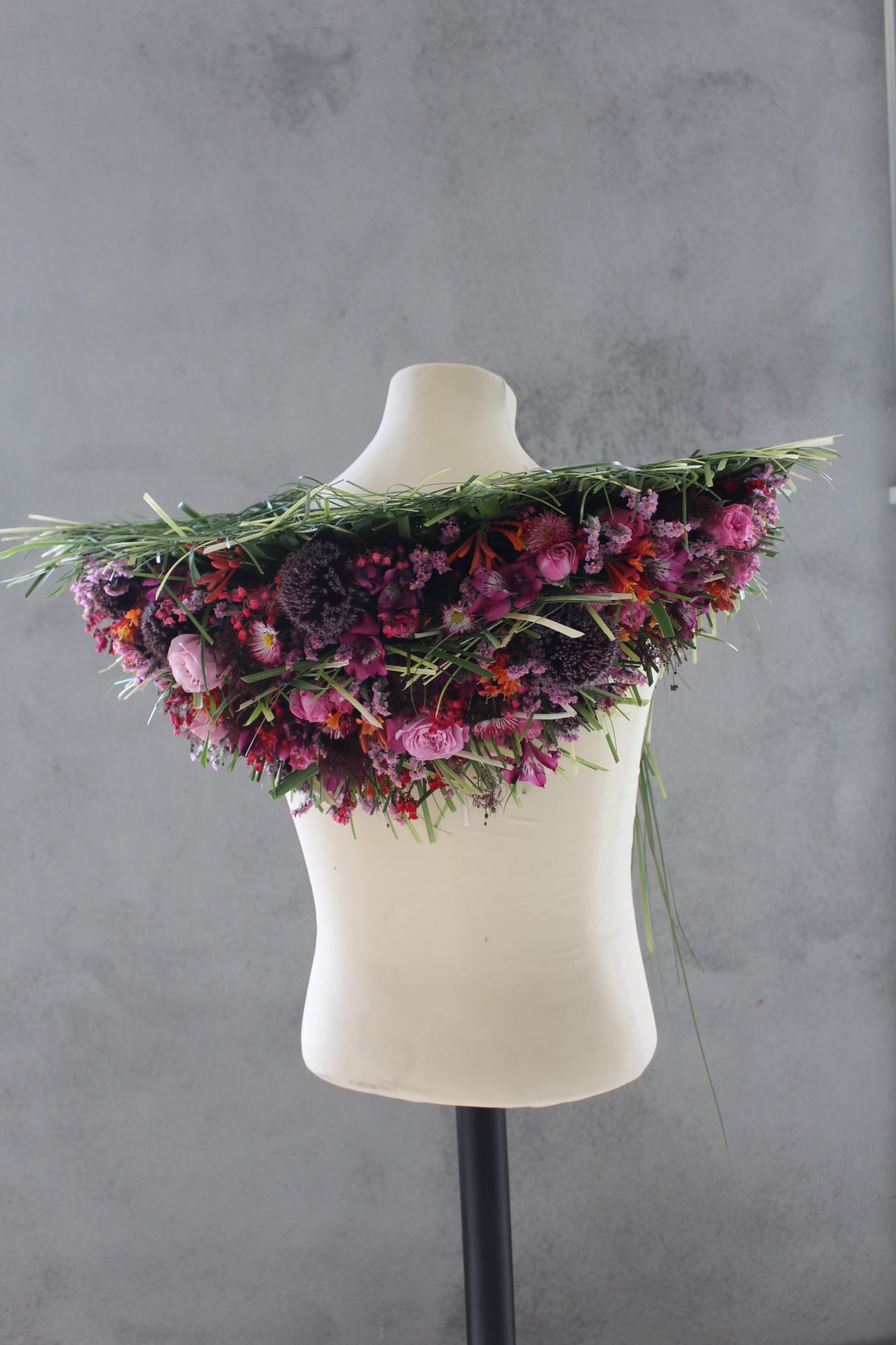 Creative arts, Floral design, Costume accessory, Lavender, Mannequin, Magenta, Petal