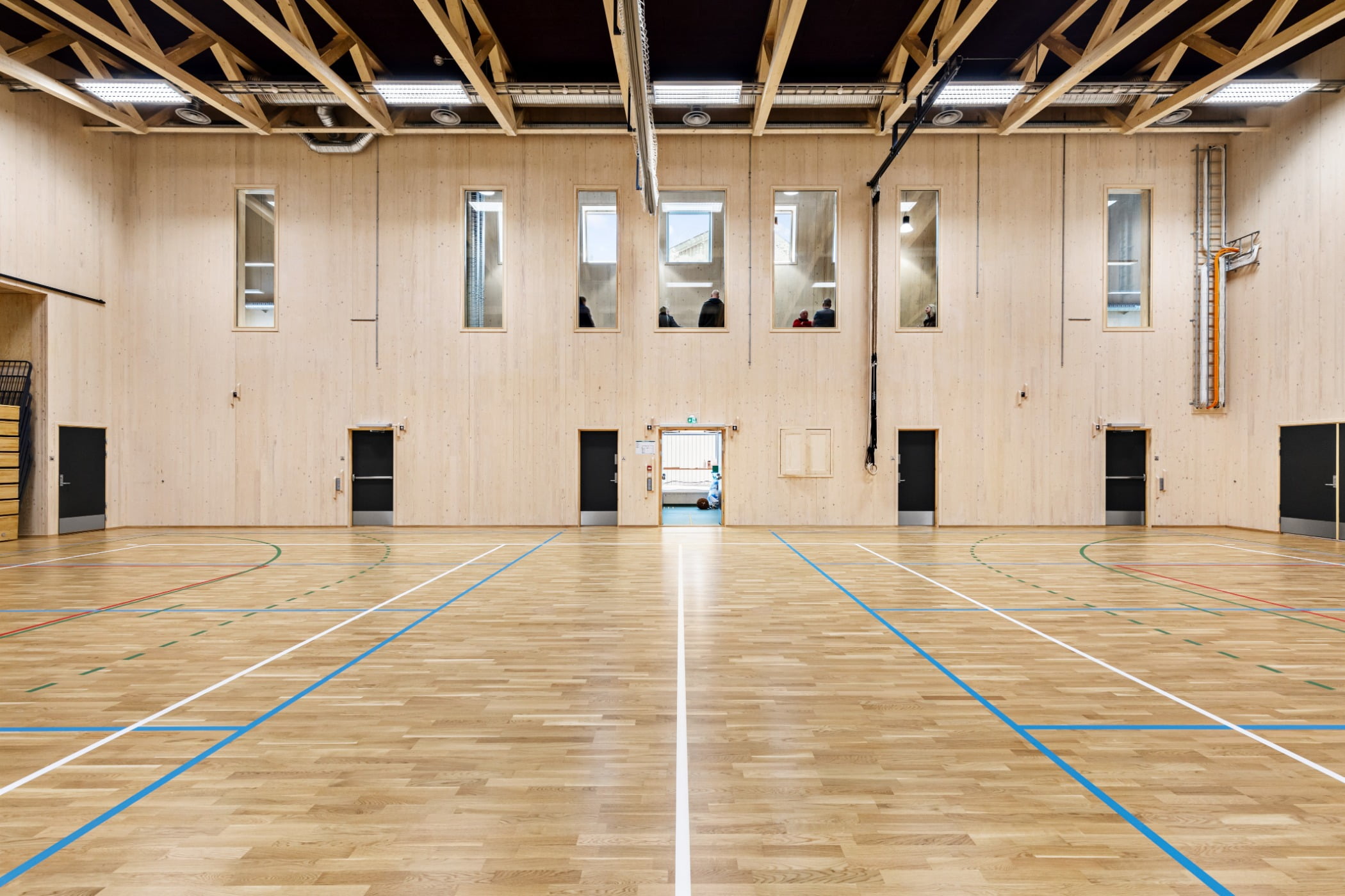 Field house, Wood stain, Hall, Architecture, Flooring, Floor, Fixture, Line, Building