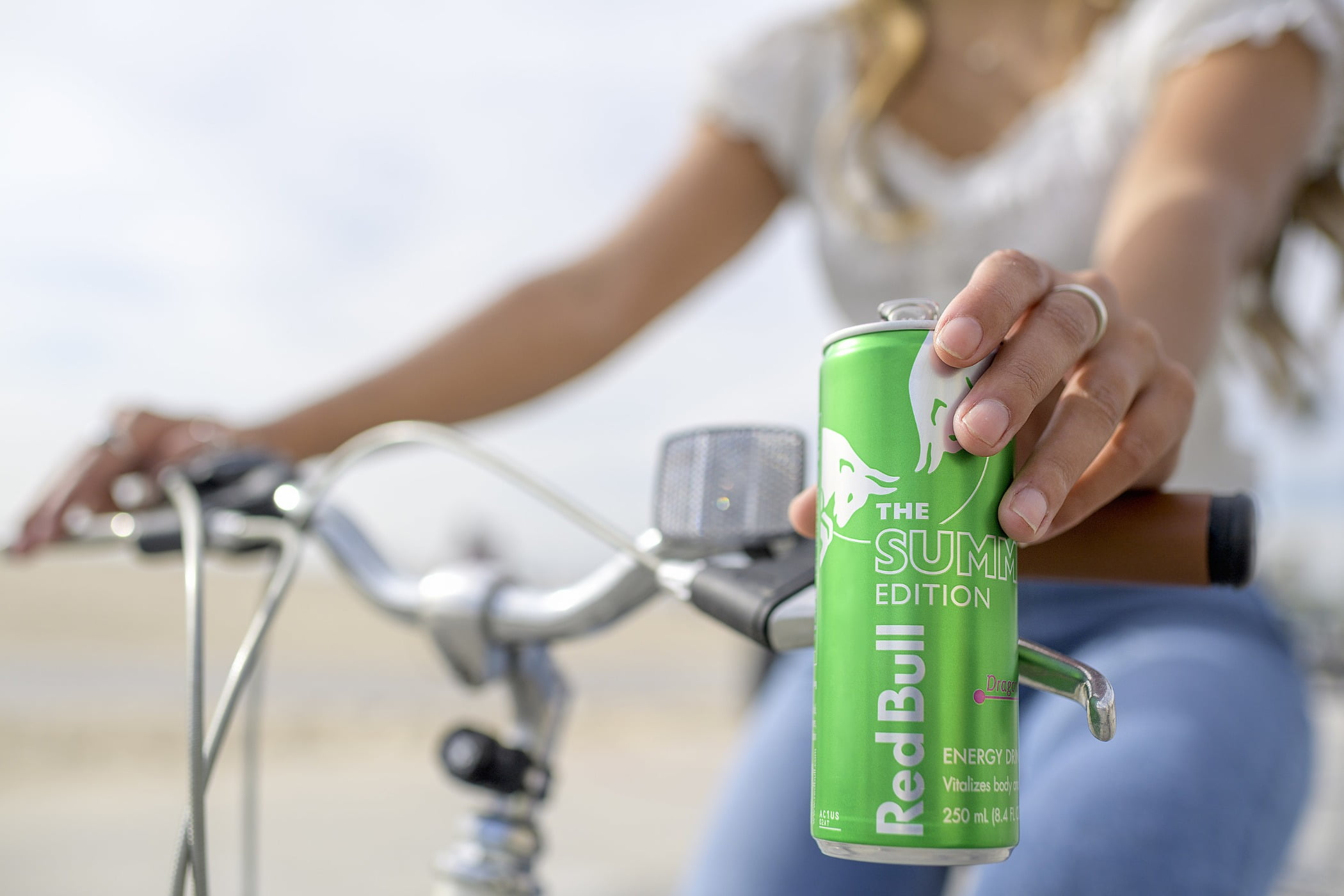 Bicycle handlebar, Hand, Drinkware, Tap, Gesture, Finger, Vehicle